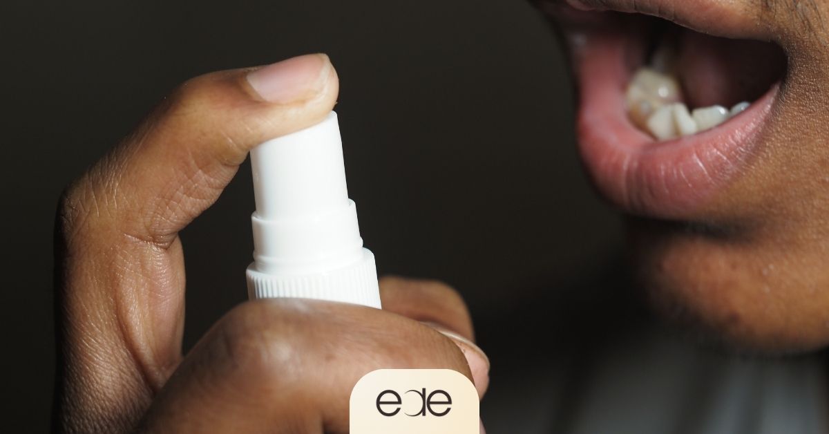 Using a mouth spray for quick breath freshening as part of daily oral care