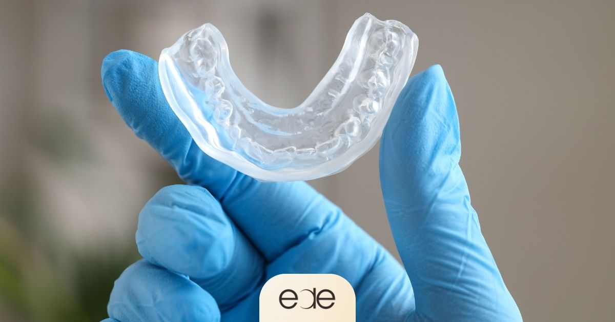 Clinical close-up of a custom-fitted mouth guard used to support gum health and prevent further recession